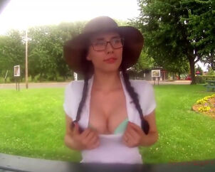 German female displaying mounds in the park before oral job